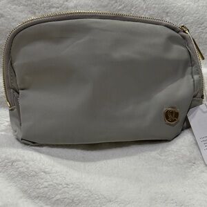 Lululemon Everywhere Belt Bag 1L in the vapor color with gold hardware.